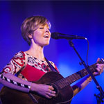 Emily Barker playing guitar